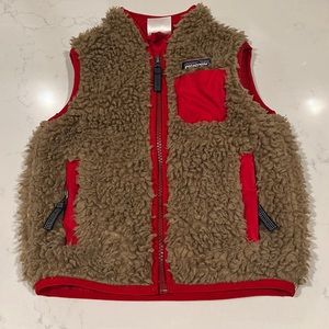 Patagonia feece vest! So cute! No damages. Minor stain. Pictured